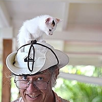 man with cat on head